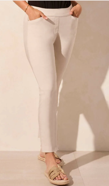 Beige pants worn by a person on a plain background
