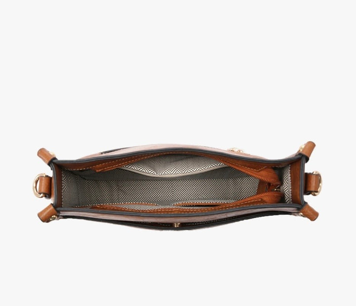 Black matte vegan leather Posie crossbody bag with wide black woven guitar strap and silver hardware