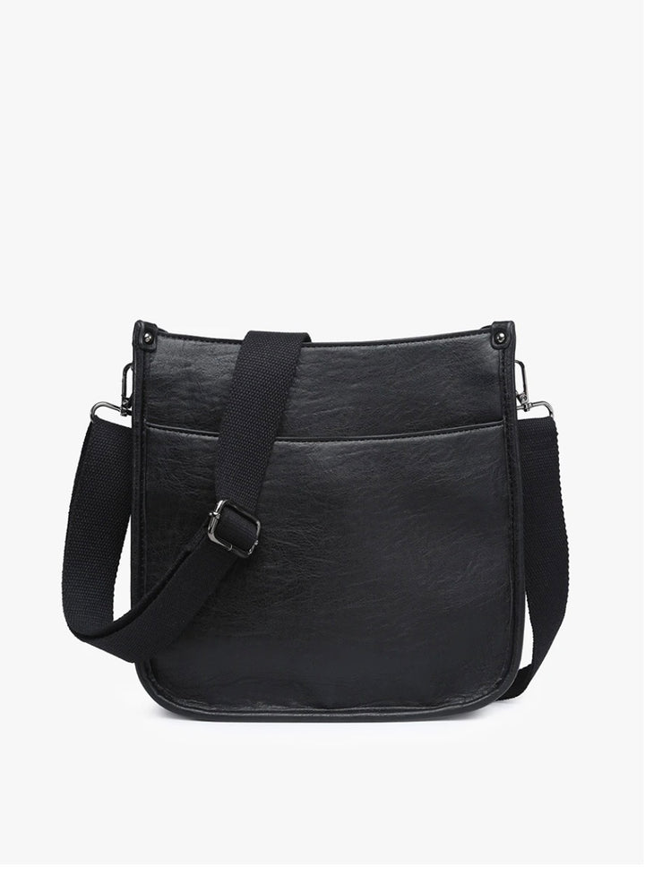 Interior view of the Black Posie crossbody bag showing herringbone lining and interior zip pocket