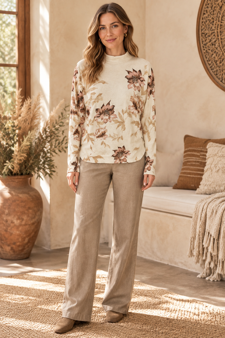 Floral pullover in a sunlit interior